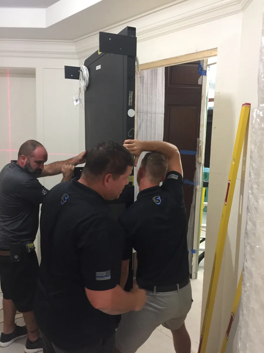 Crew installing a security door